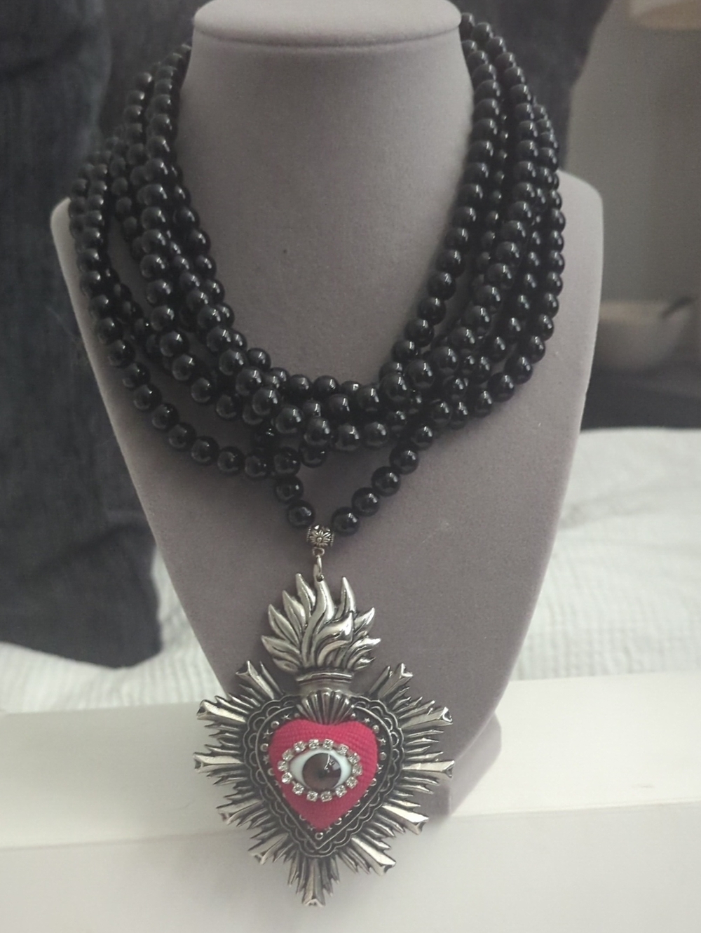 Multi-Strand Black Bead Necklace with Red Heart Pendant
